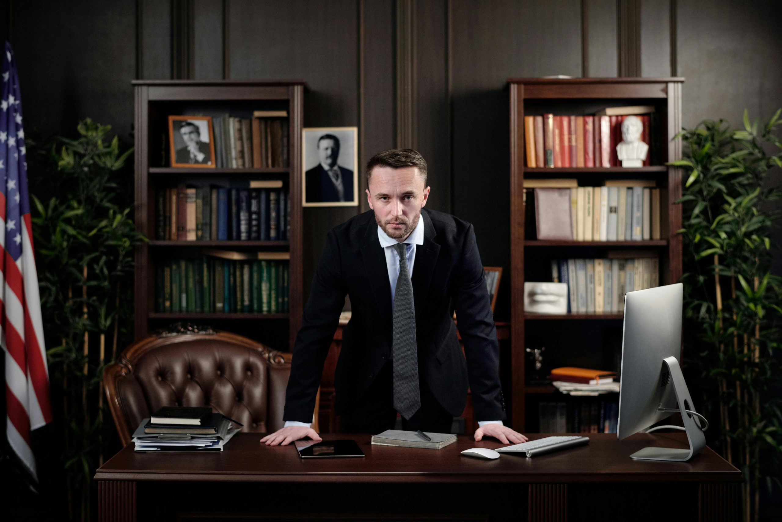Staunch attorney standing angrily at desk